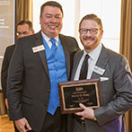 Henry D. Kass accepted the Board of Directors Award from outgoing President J. Matthew Pfeiffer